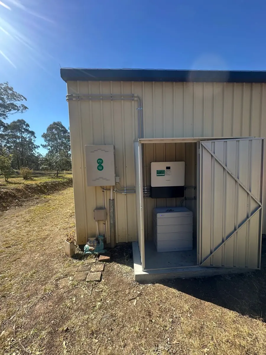 Electrical enclosures beside an open shed doorway
